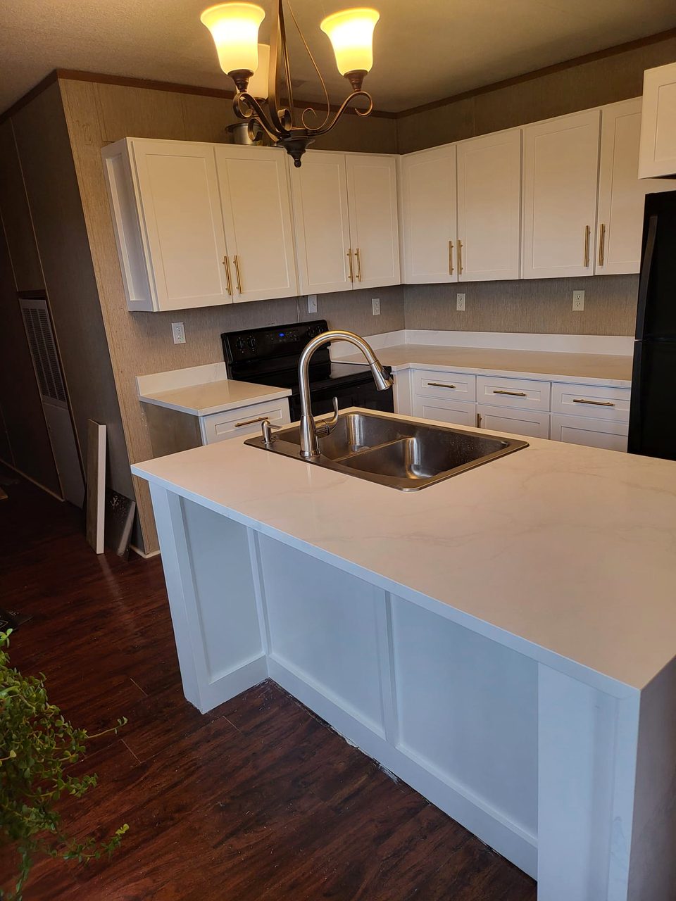 Quartz countertops in a refaced white kitchen
