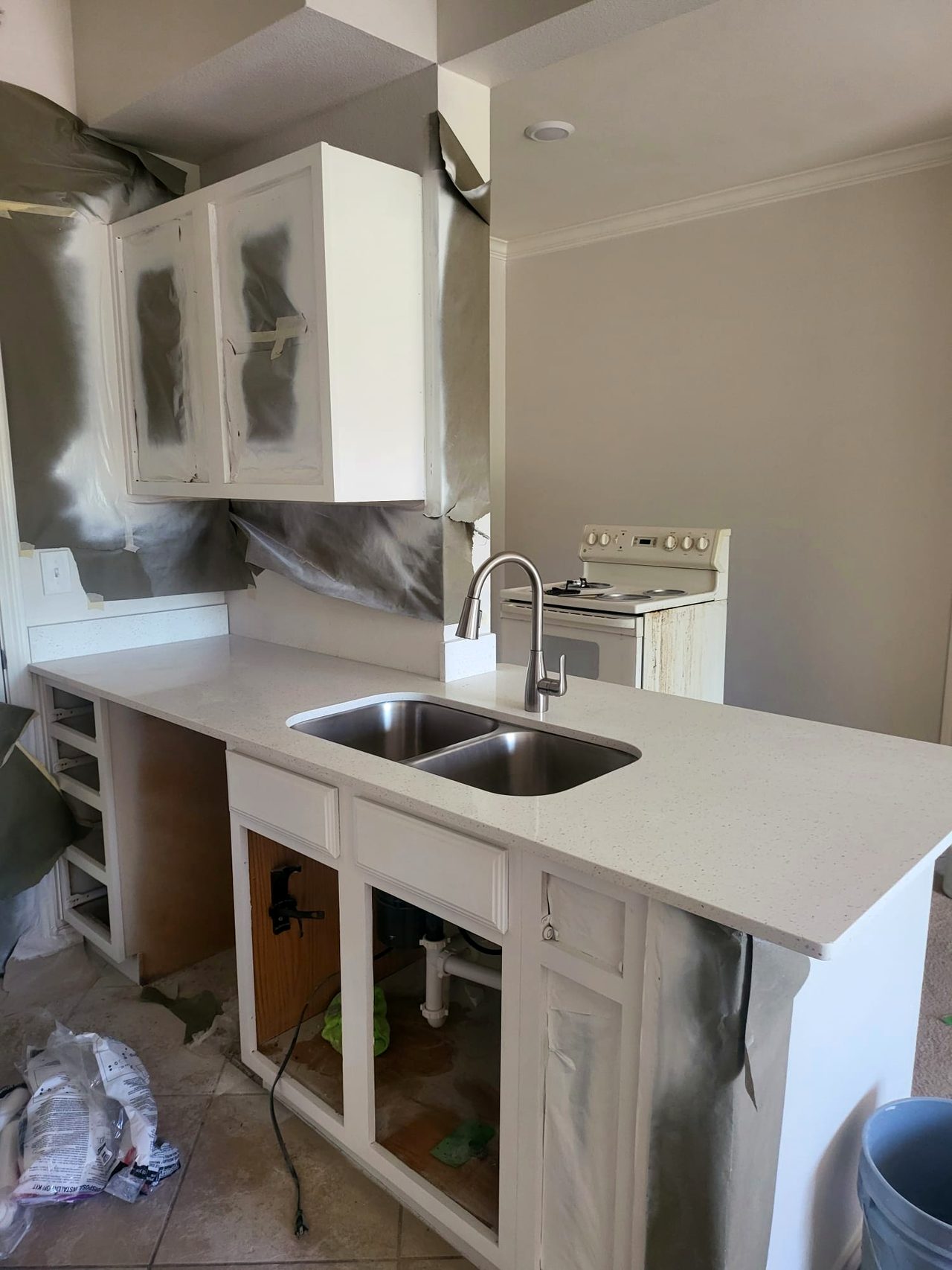 Cabinets masked and prepped for professional spray painting